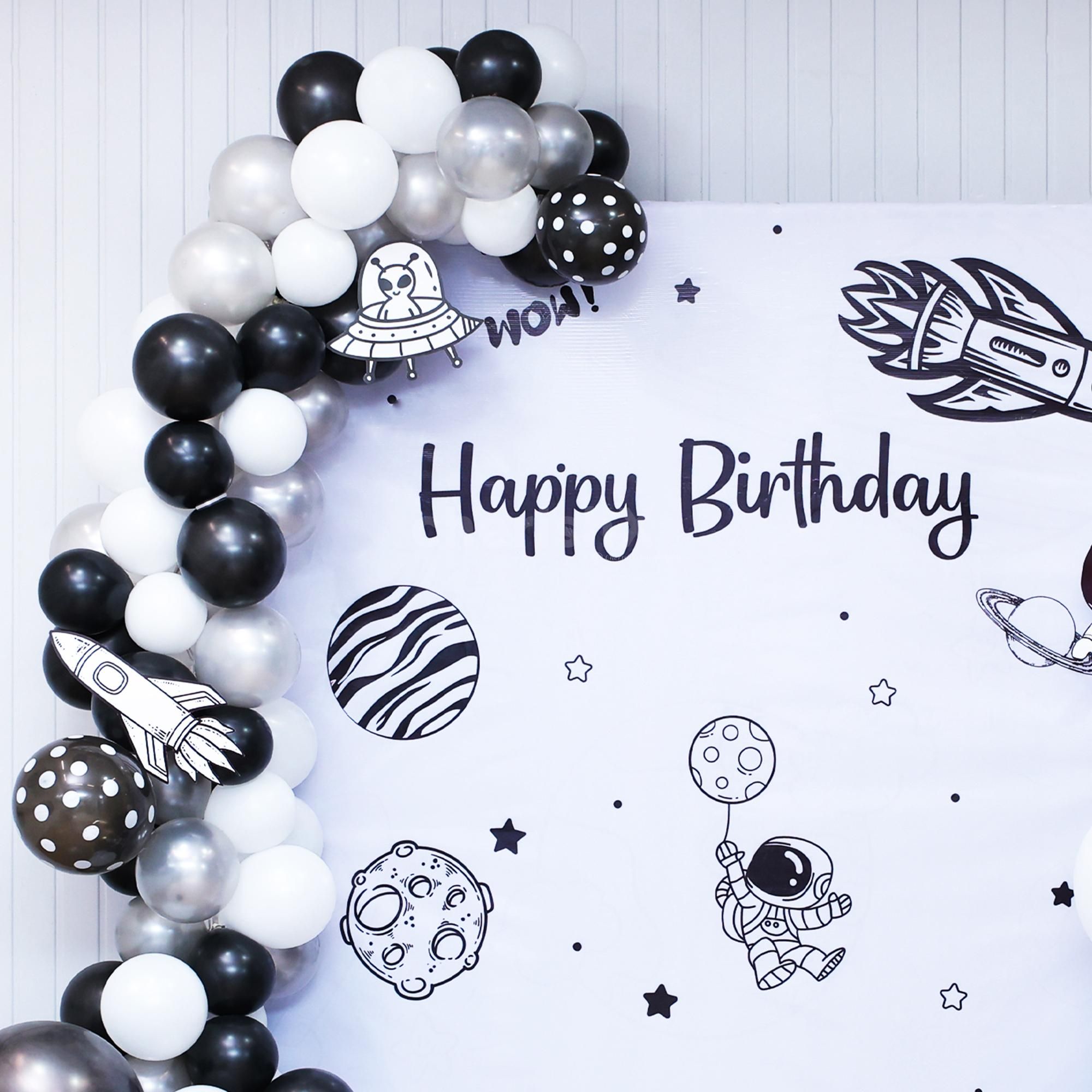 Foil balloons and star strings add a sparkle to each moment.