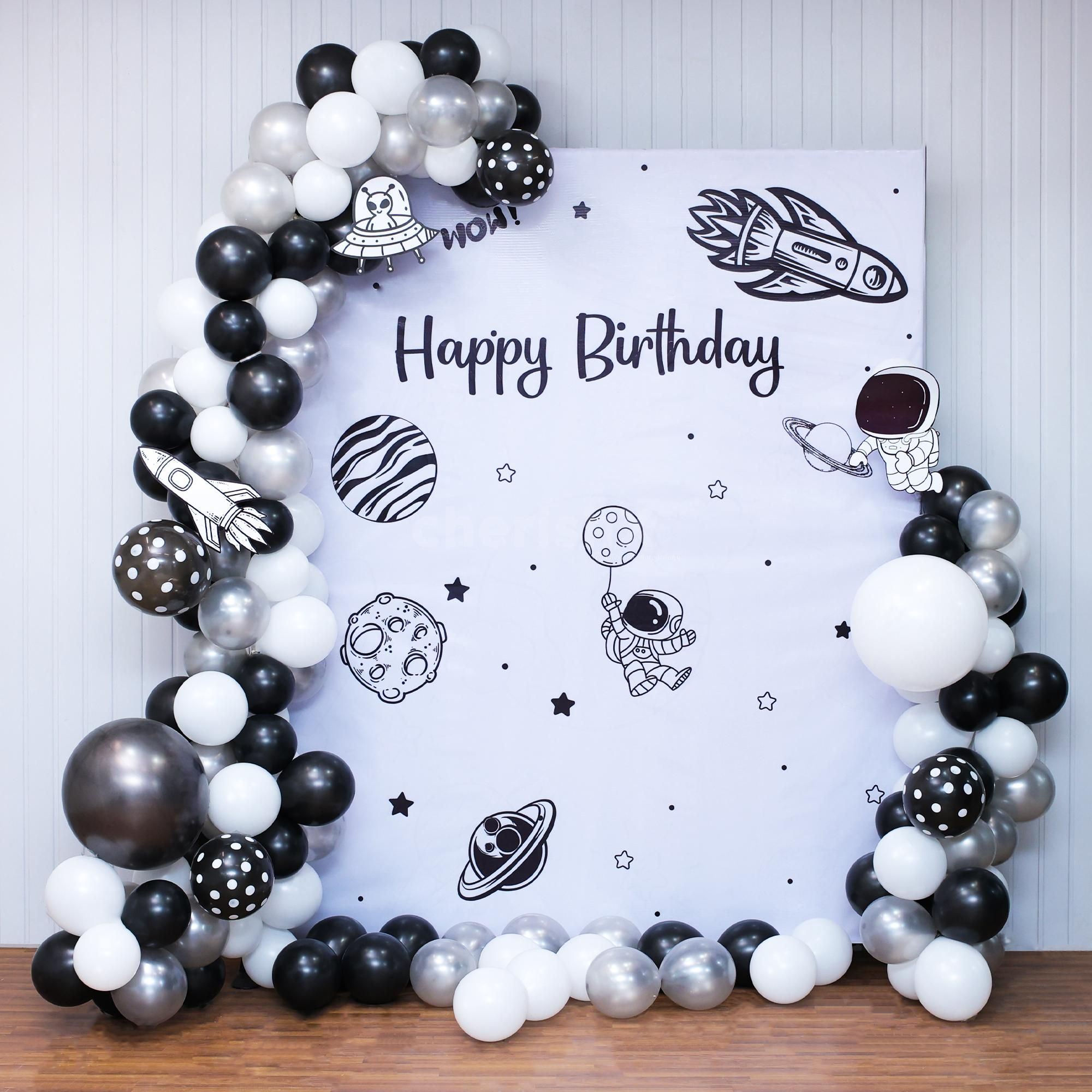 Glowing galaxy flex backdrop under a neon birthday sign.