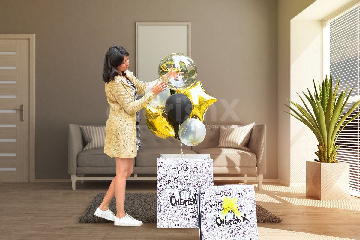 The surprise box consists of different coloured helium balloons.