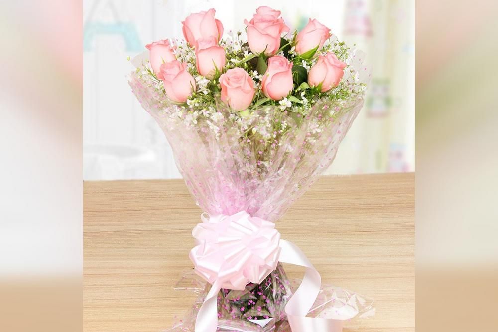 Pink roses with a heart shape chocolate truffle cake delivery at home