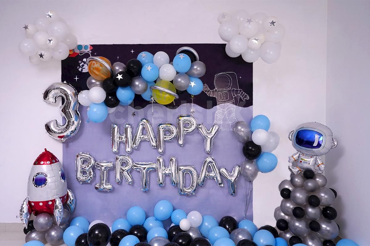 Celebrate your kid's birthday with this adorable Space themed birthday room decor.