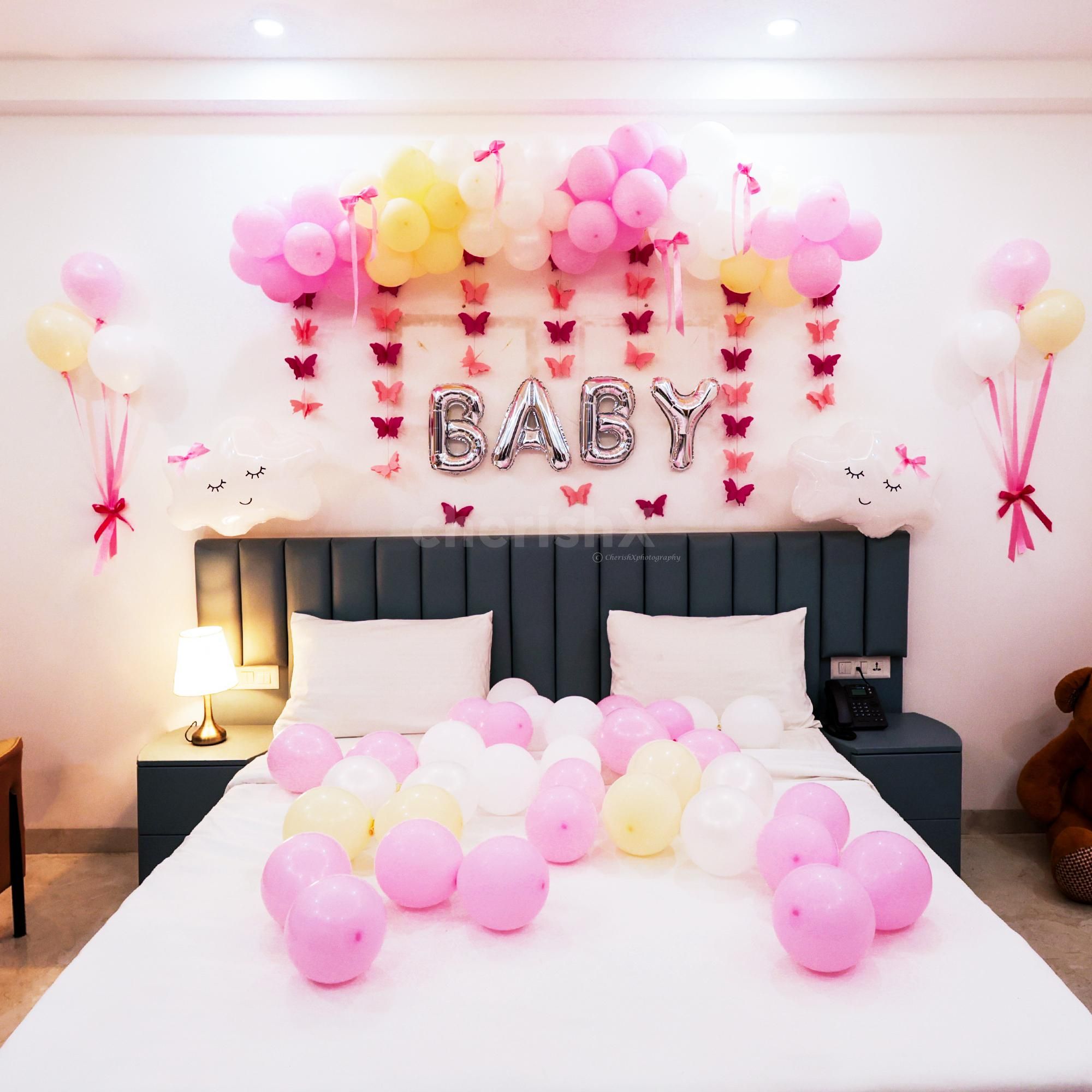 A gentle curve of pastel balloons creates a whimsical atmosphere for the welcome room.