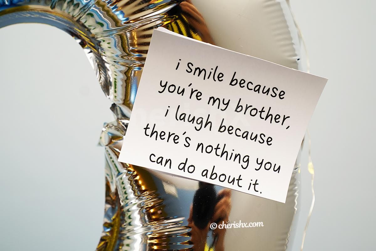 Two Rakhi messages are attached with balloon bouquet.