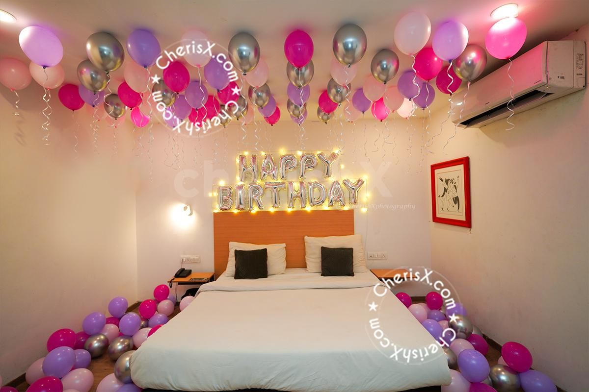 The silver happy birthday foil added with the balloons is an attractive piece of décor