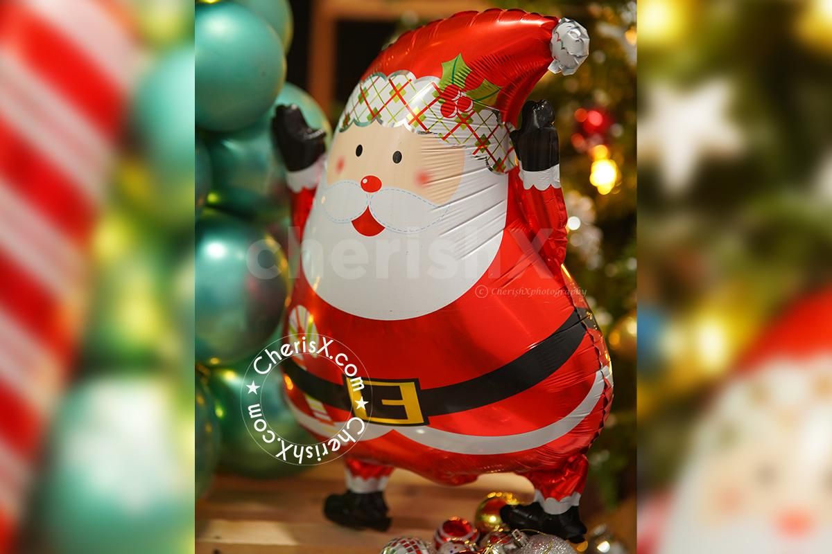 The brightly coloured balloons on the Christmas tree are sure to make it even more magical