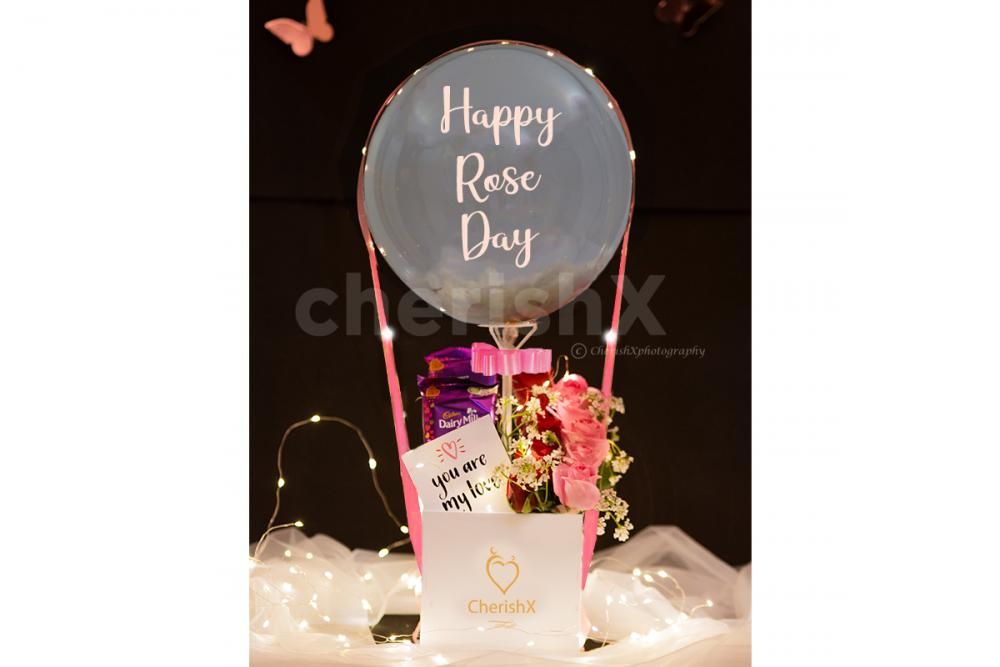 Get a beautiful Candy Flowers Balloon Bucket for your special one.