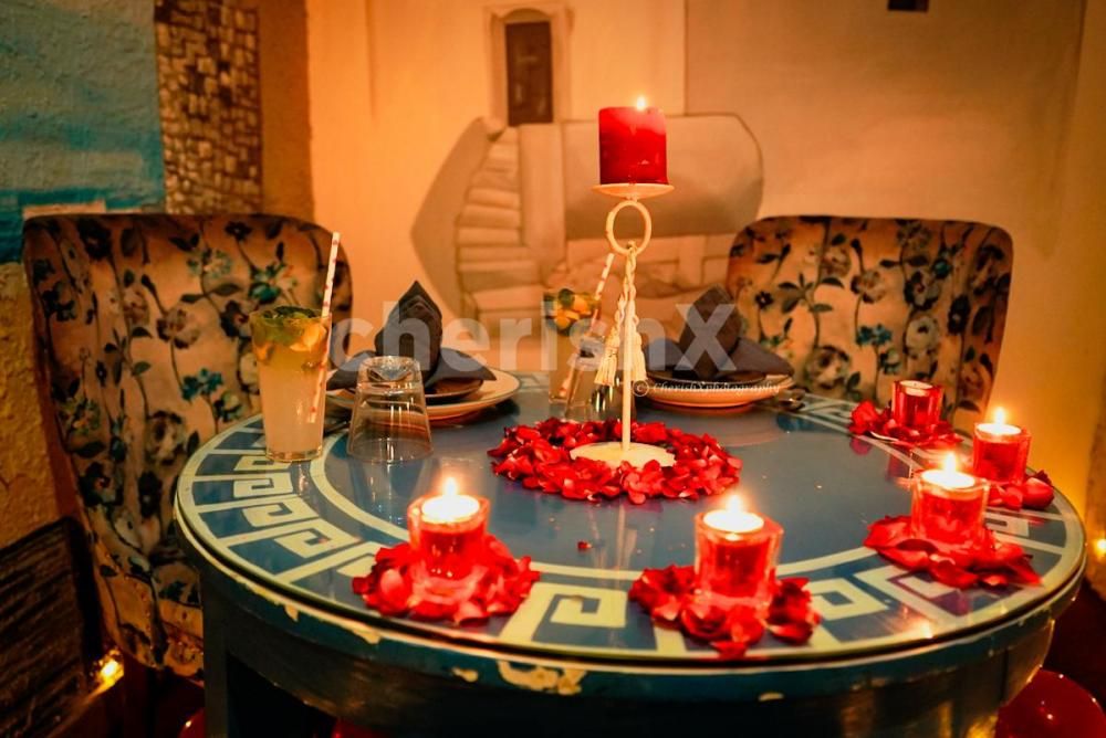 The decorations with roses and candles set the romantic vibe.