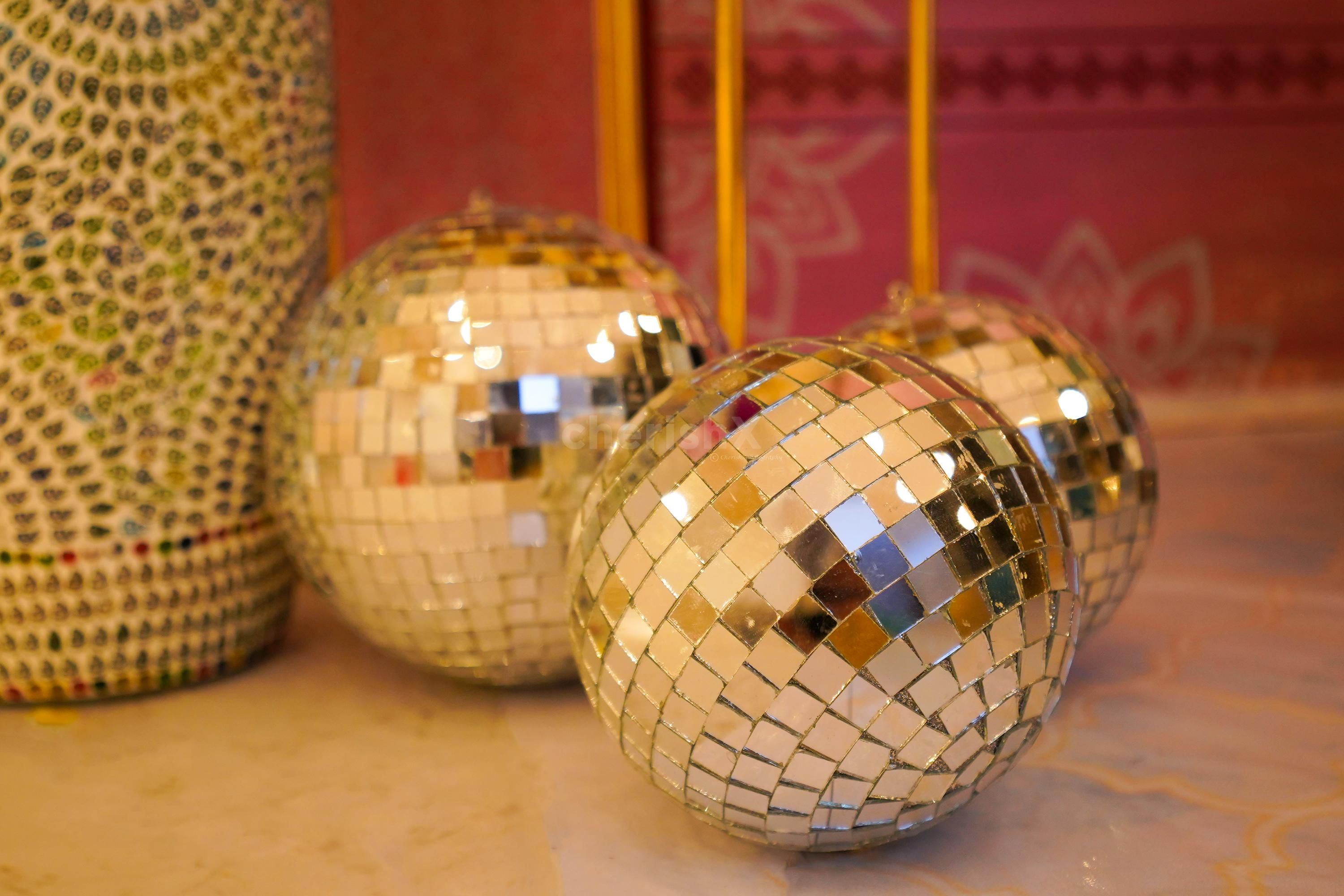 The golden flower pots add a charming atmosphere to the Mehndi and Haldi ceremony