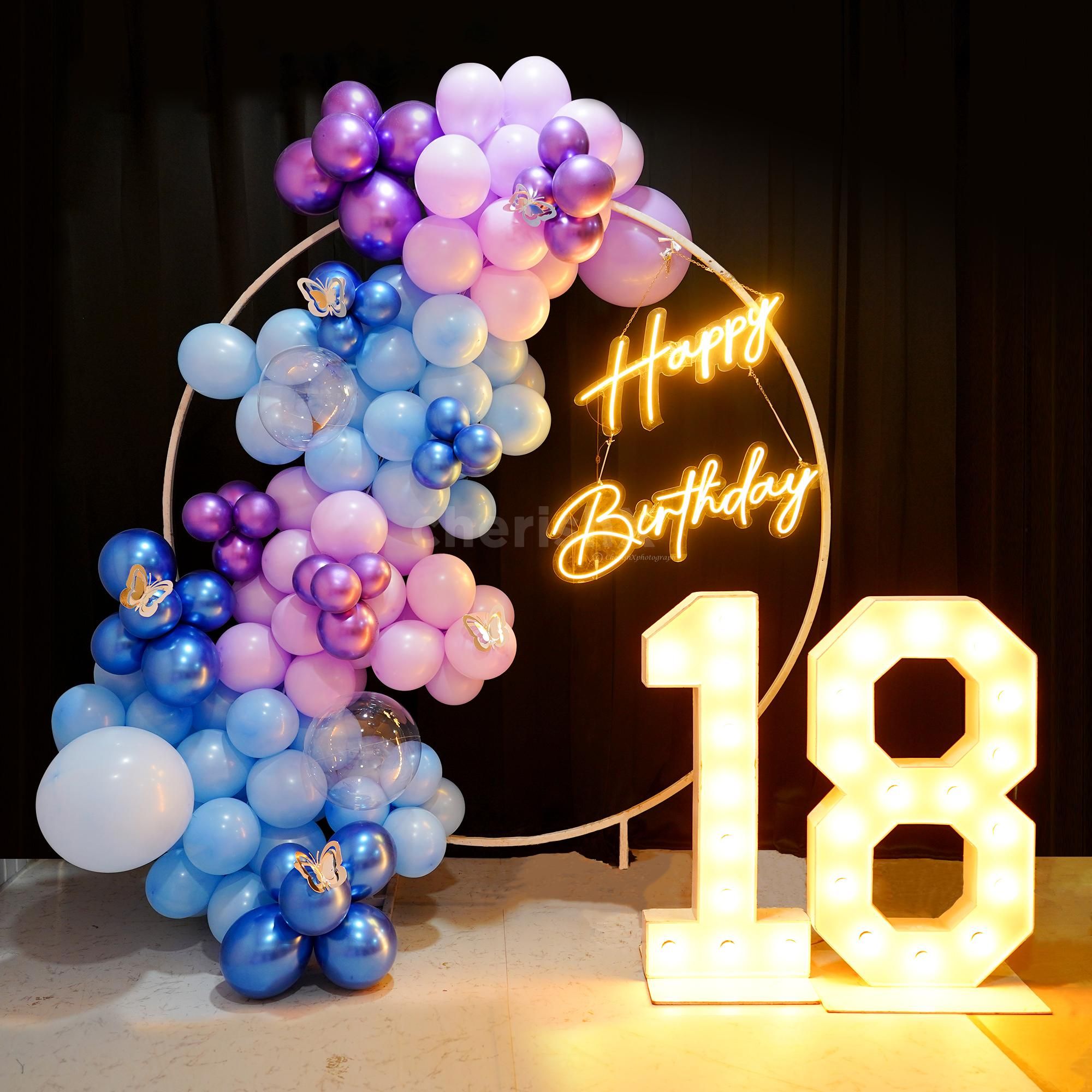 Enhance any occasion with countless blue and purple chrome balloons.