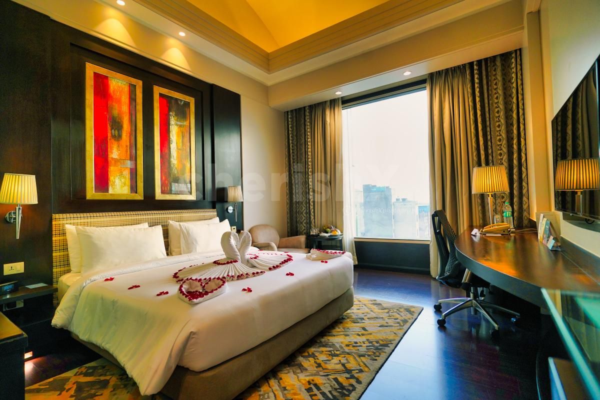 Rose petals on the bed will add a romantic flair between the two.