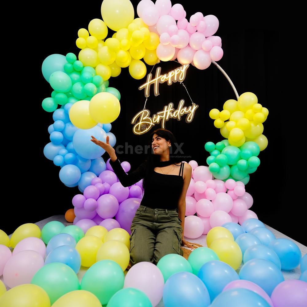 Add a touch of magic to your special day with our stunning rose gold and white balloon backdrop.