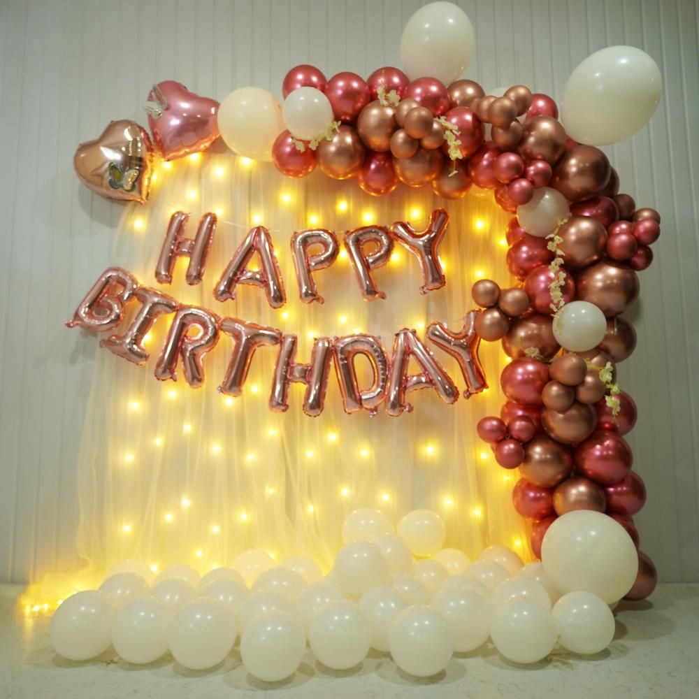 A stunning backdrop adorned with radiant rose-shaped decorations creates an ethereal atmosphere of elegance and charm.