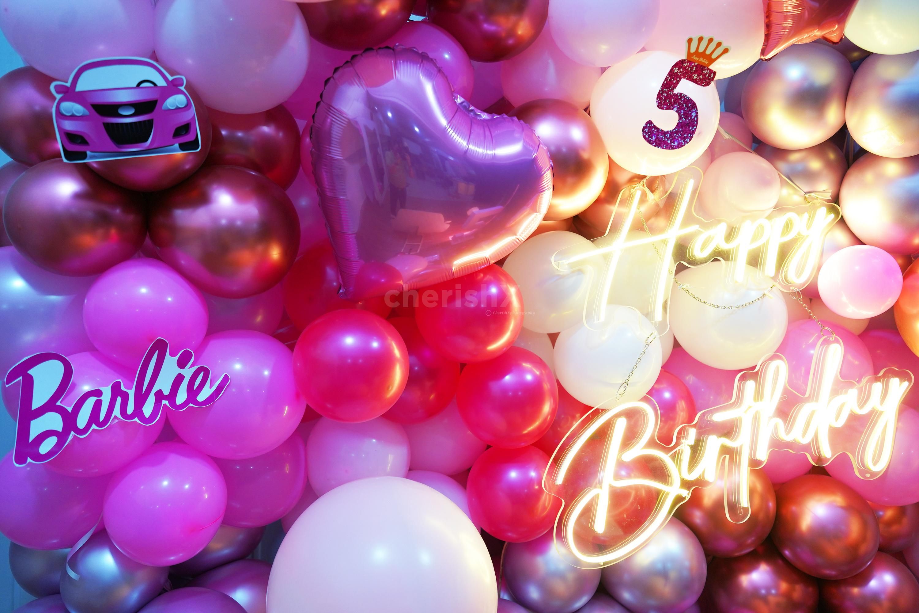 Enchanting Barbie and car cutouts add more magic to the party