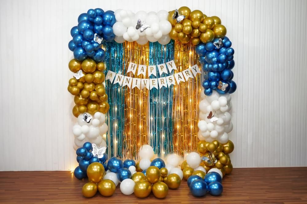 A shimmery frill of gold and blue accents adorns the backdrop, creating a breathtaking skyline for your grand anniversary celebration.