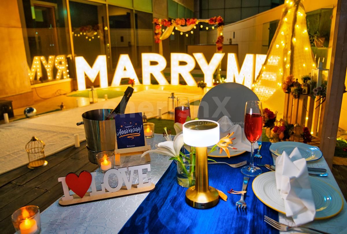 Whimsical elegance poolside decorations illuminated by soft pixel lights.