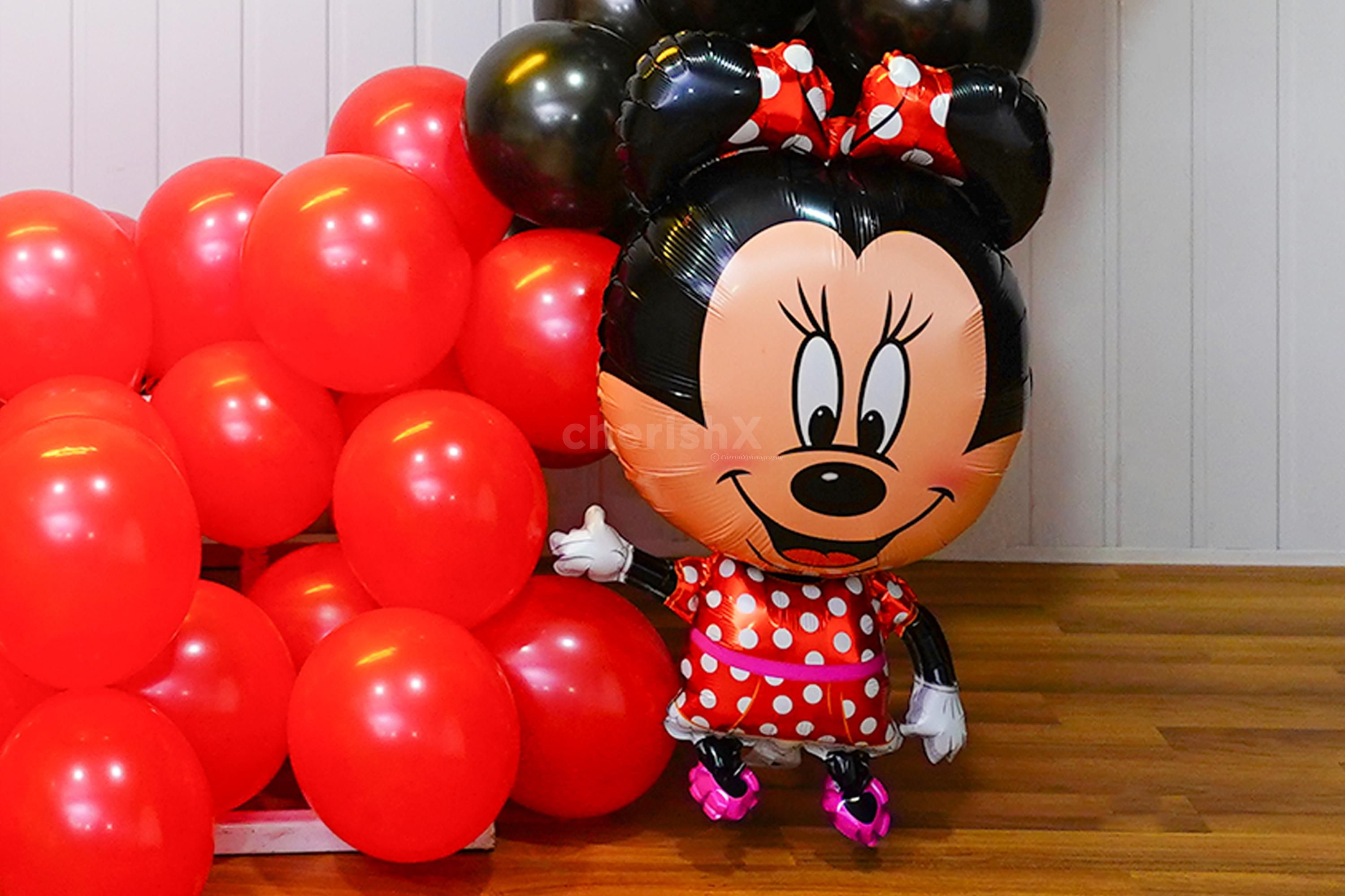Decoration comes with a pair of Mickey and Minnie foil balloons and 10 paper cutouts.q