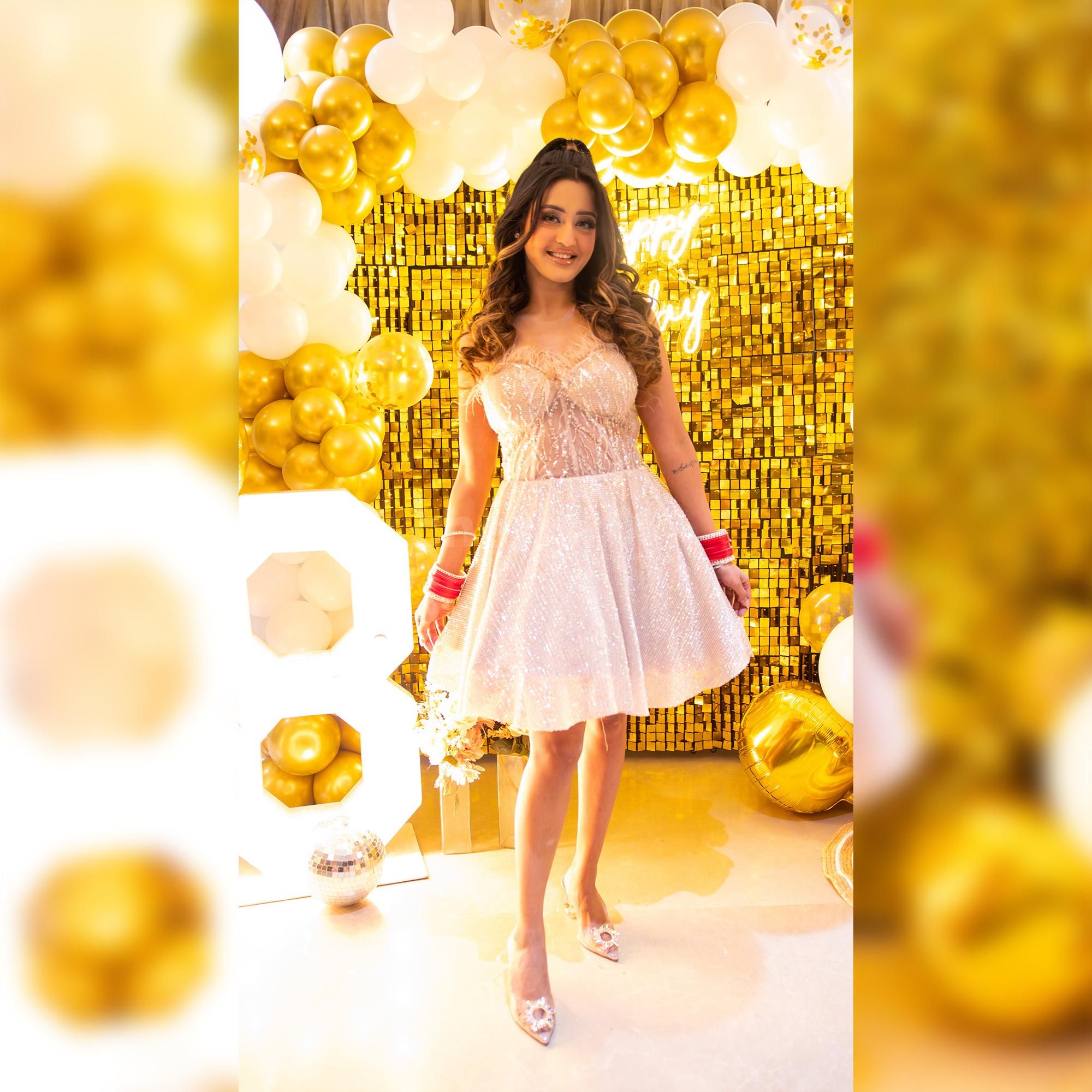 Make a statement with this golden sequin backdrop for your birthday party.