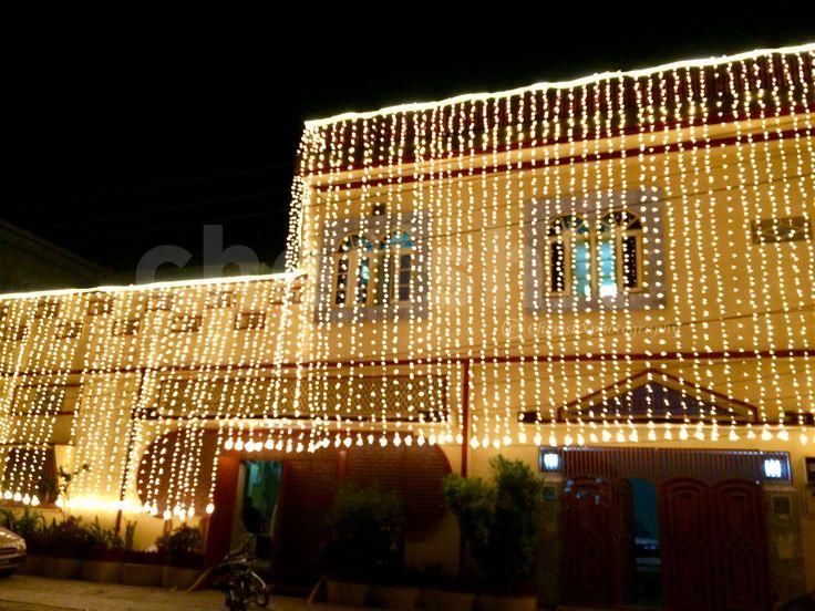 Elegant and charming fairy lights for a 20ft wide house frontage