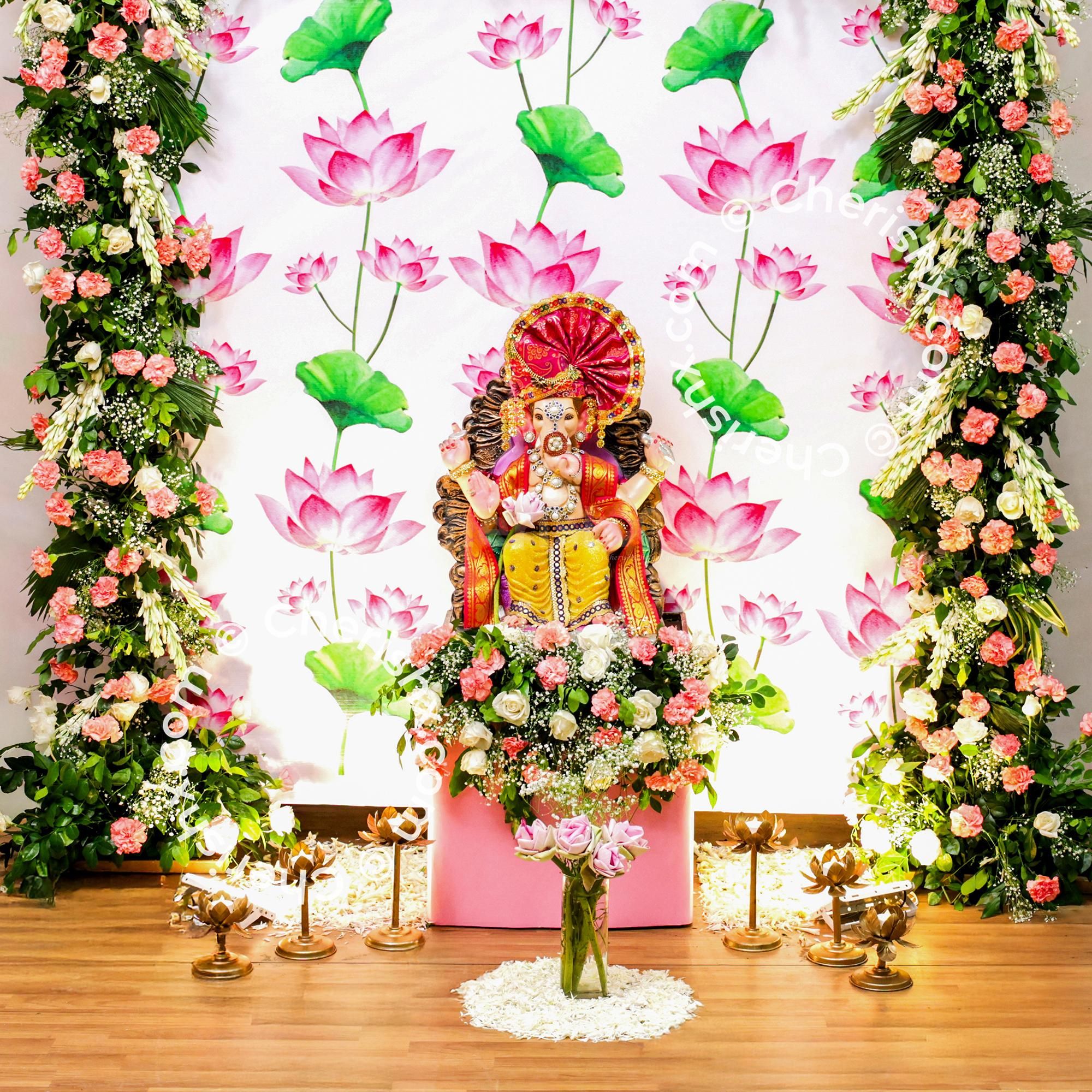 Fresh white flower petals spread across the decor highlight purity of the puja
