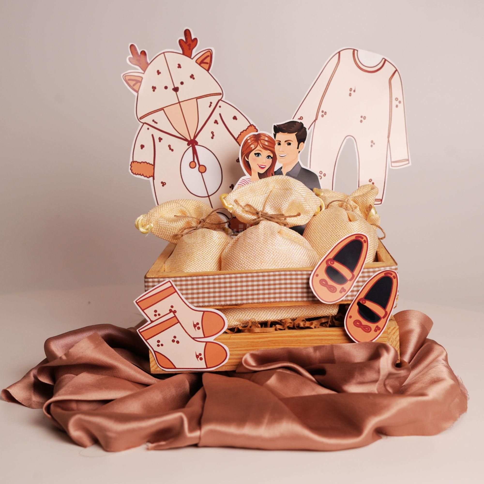 Make a new baby's life brighter with this beautifully hand-made hamper with a rustic theme.