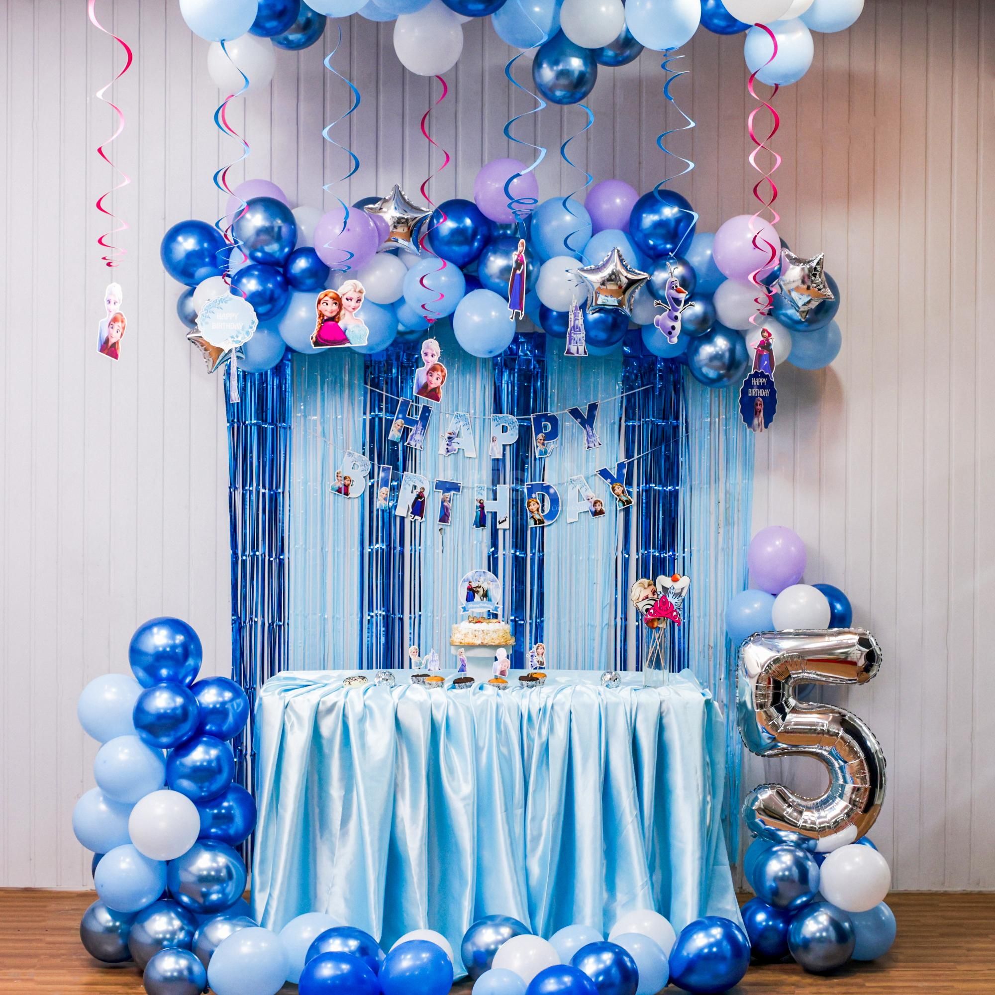 Frozen-themed balloon arch with bunting and toppers steals the party show