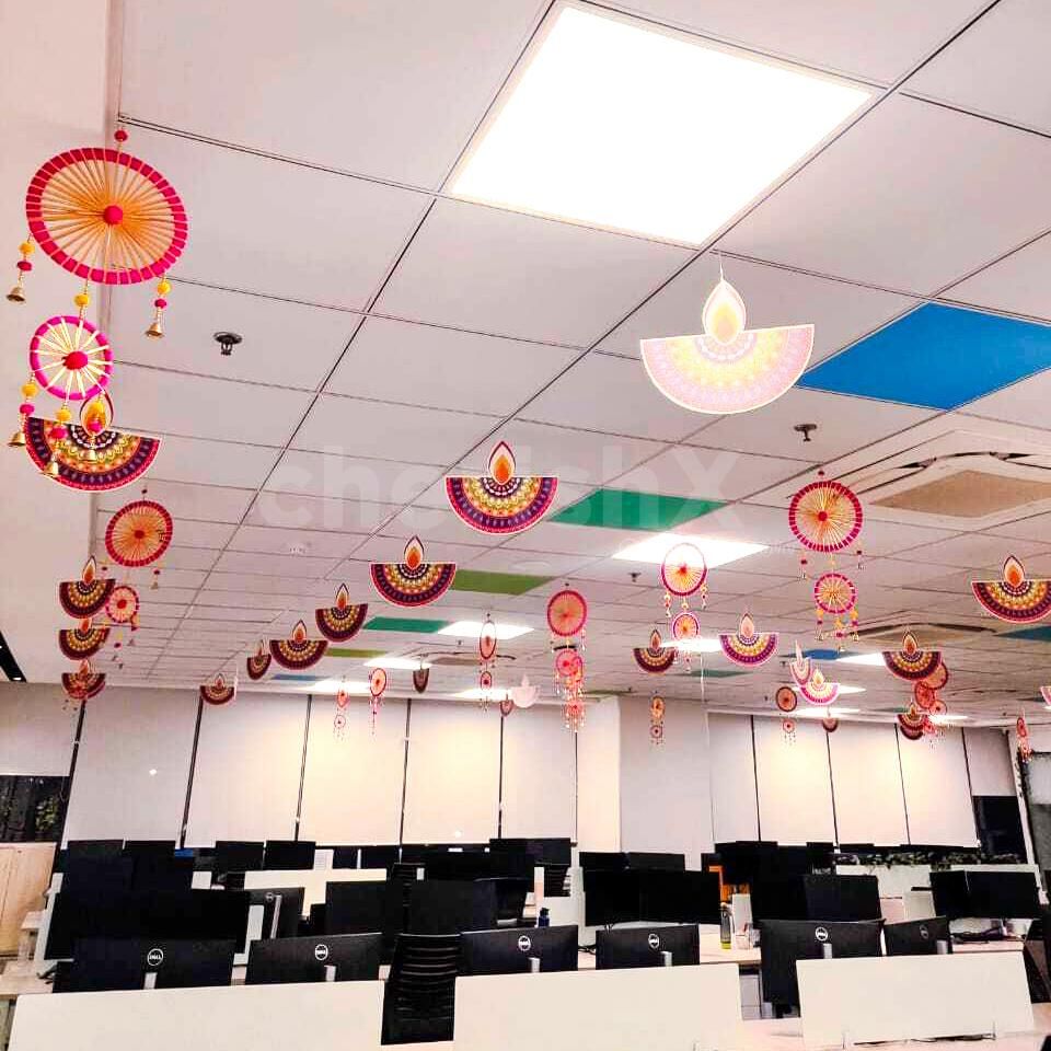 Double-sided diyas cutouts send the glowy vibes with their shimmer decoration