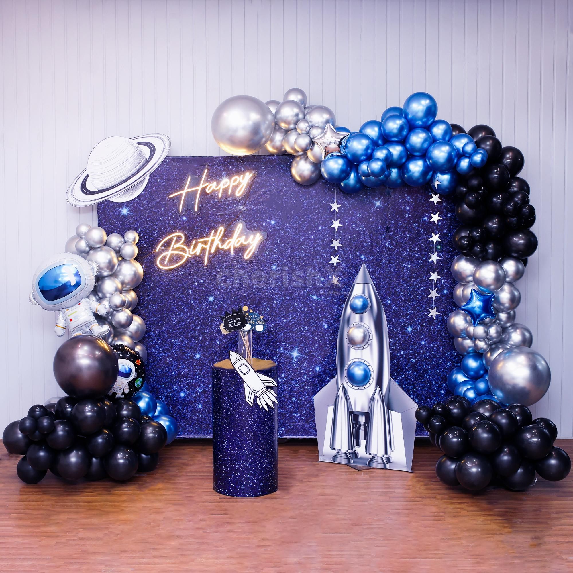 Astronaut-themed flex backdrop with planets, rockets, and beyond.