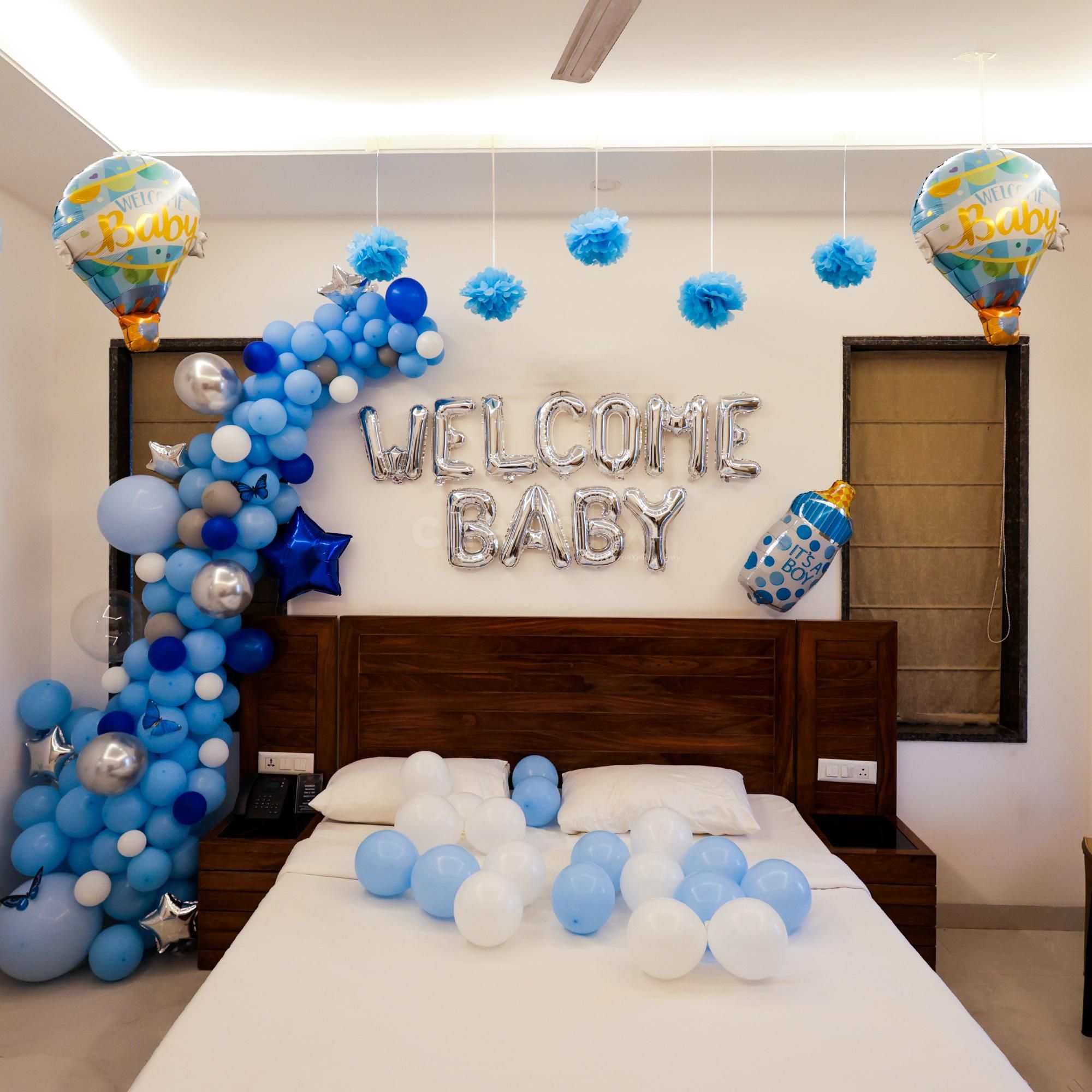 A striking blue and silver balloon arch beautifully frames the welcome message.