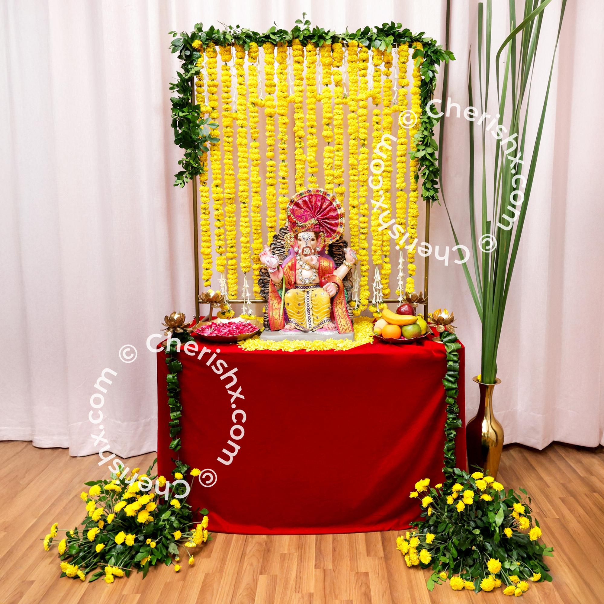 Add a burst of color to Ganesh puja with this Marigold & Rajni Floral Decor