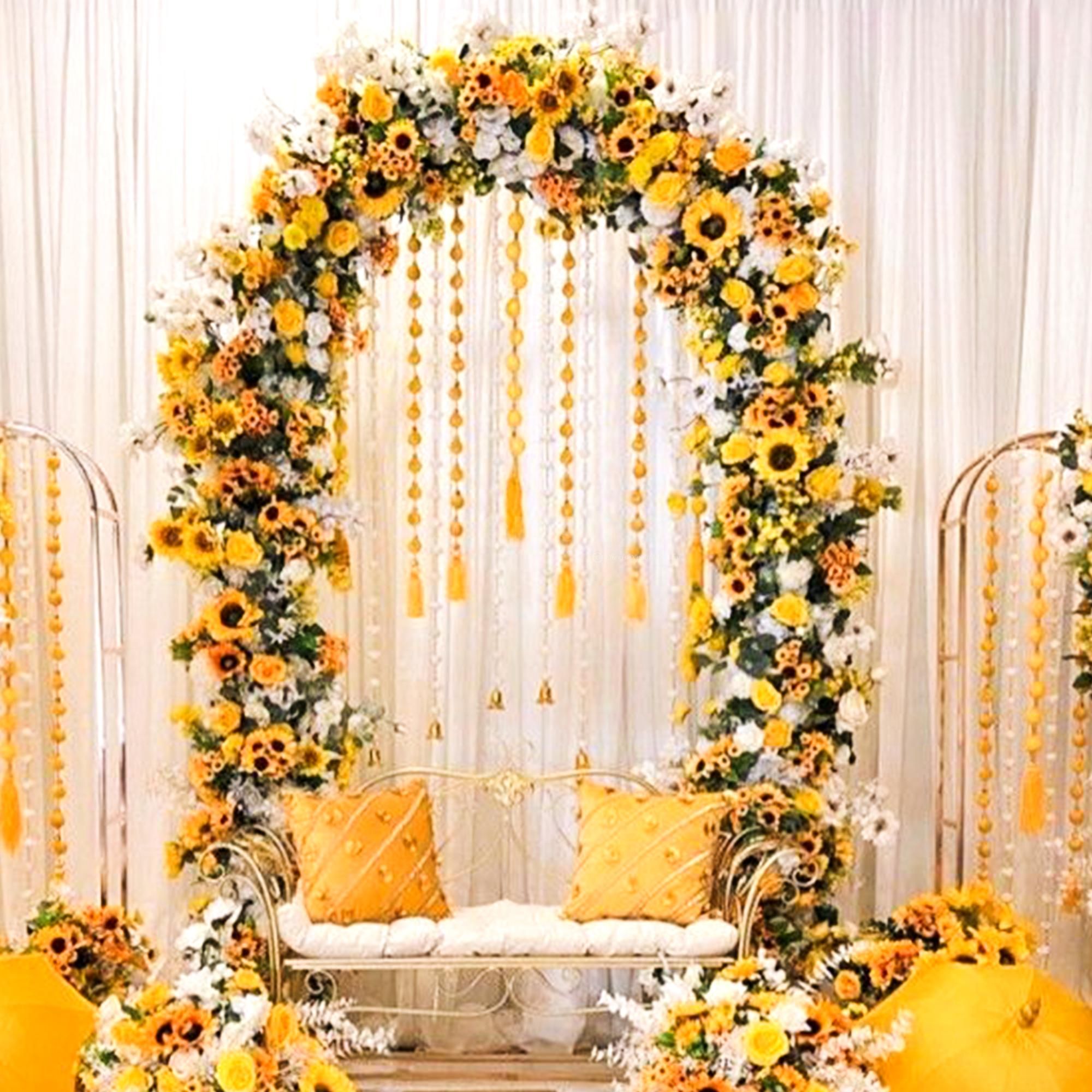 Yellow umbrellas and flowers contribute to a happy mood.