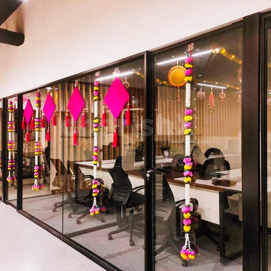 Pink crochet kites hangings add eye-catching colour to the glass walls by sticking easily