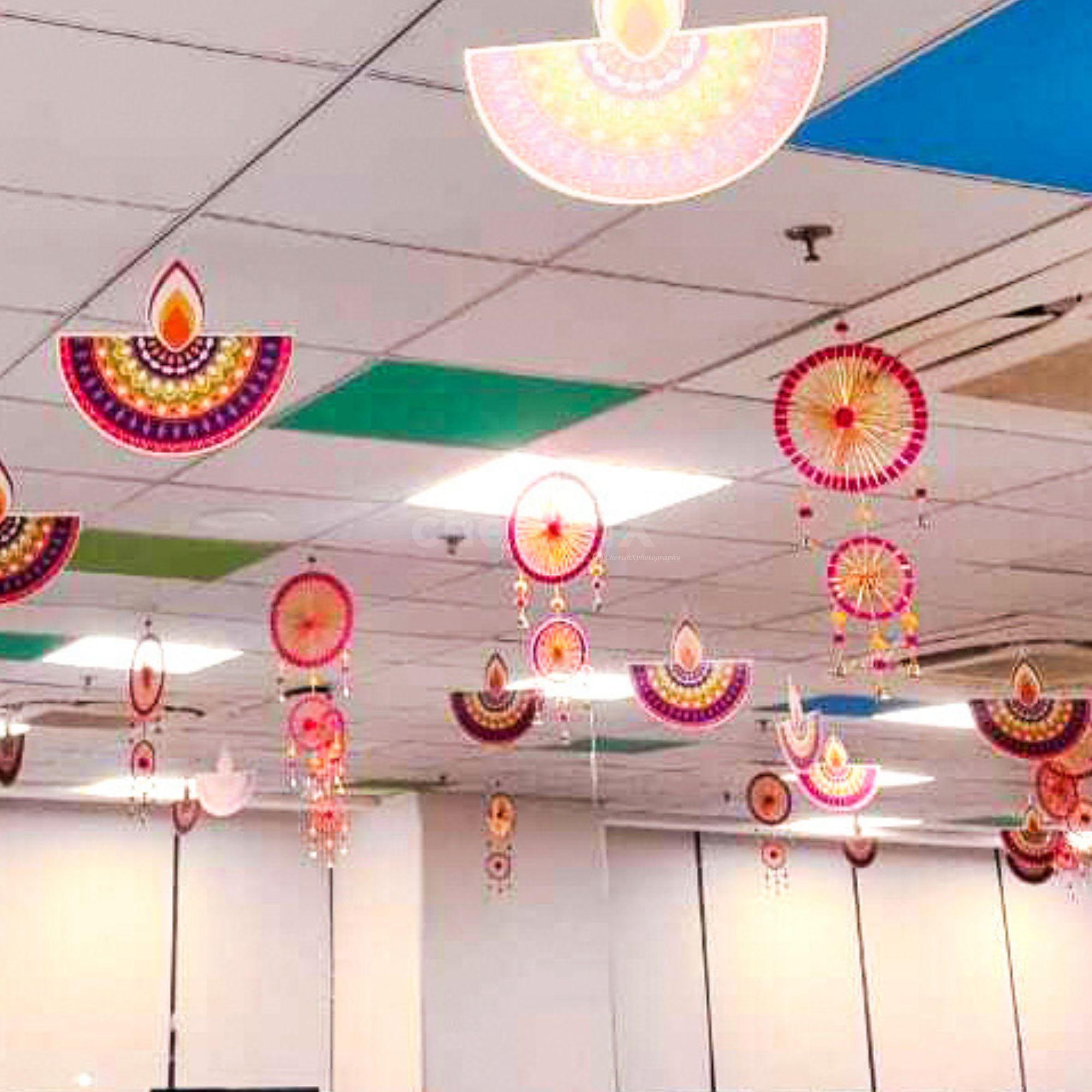 Pink hangings with bells create the perfect Diwali Impact, flowing with the air