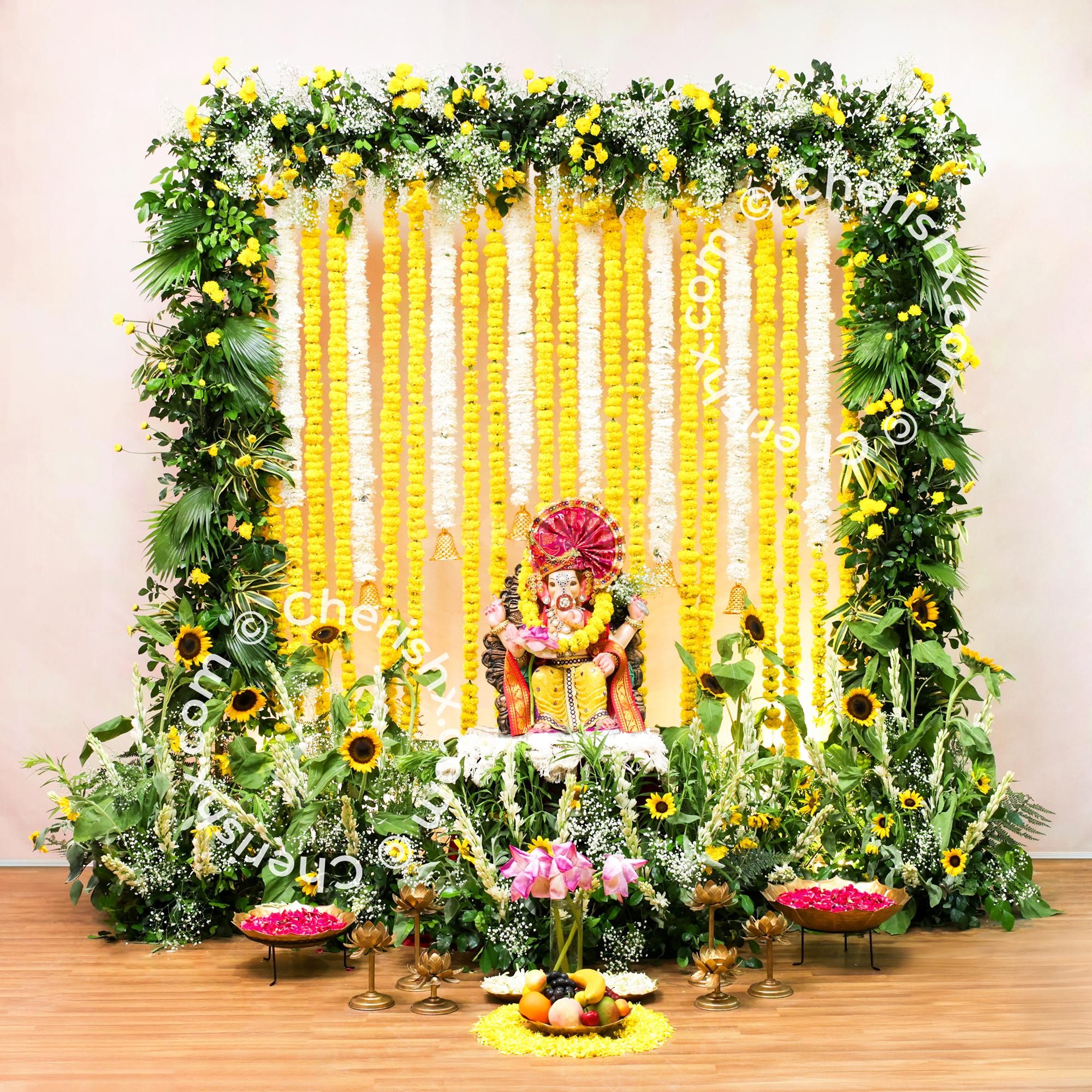 Soft and textured decor created with different types of flowers for ganpati decor