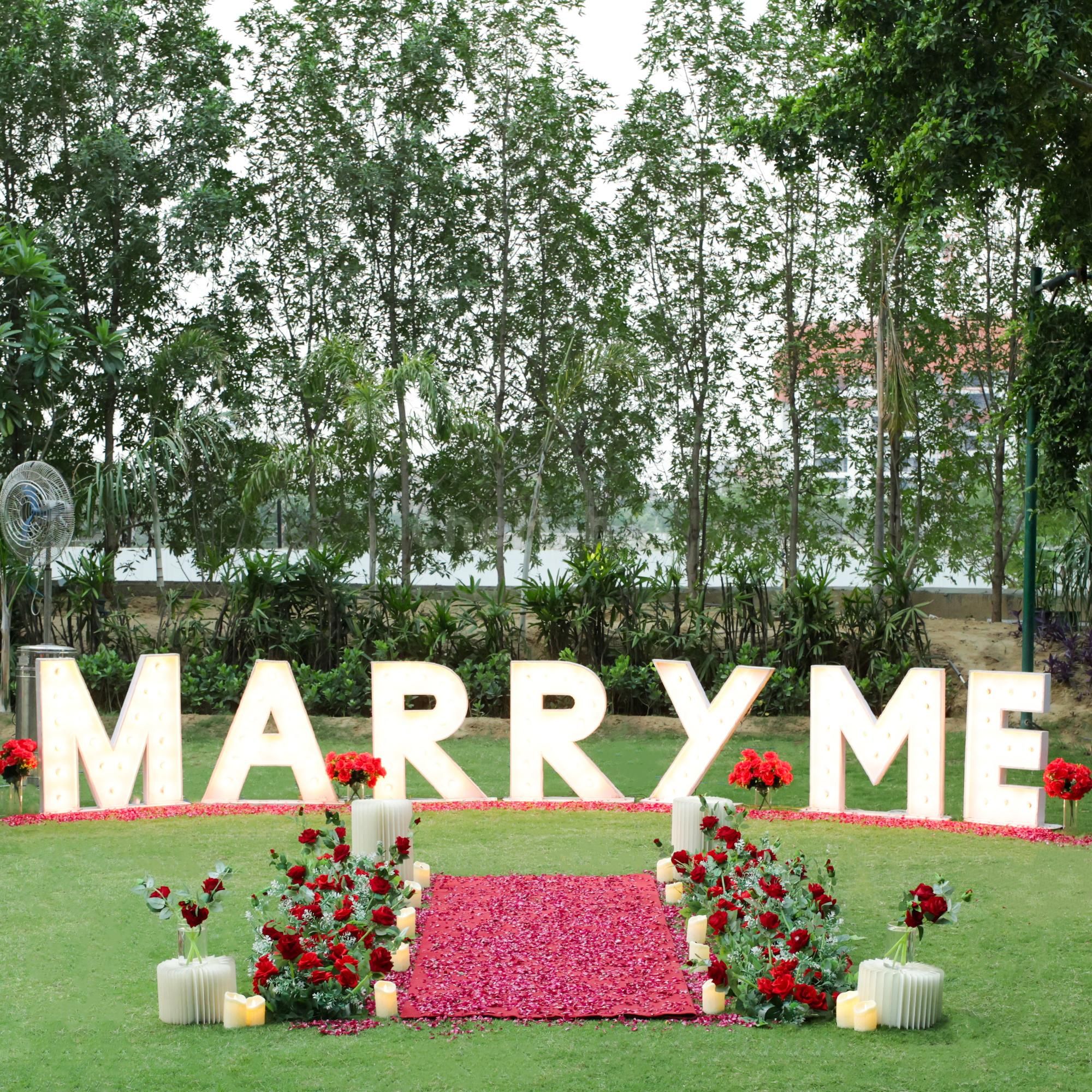 Romantic rose-petals aisle under candlelight.