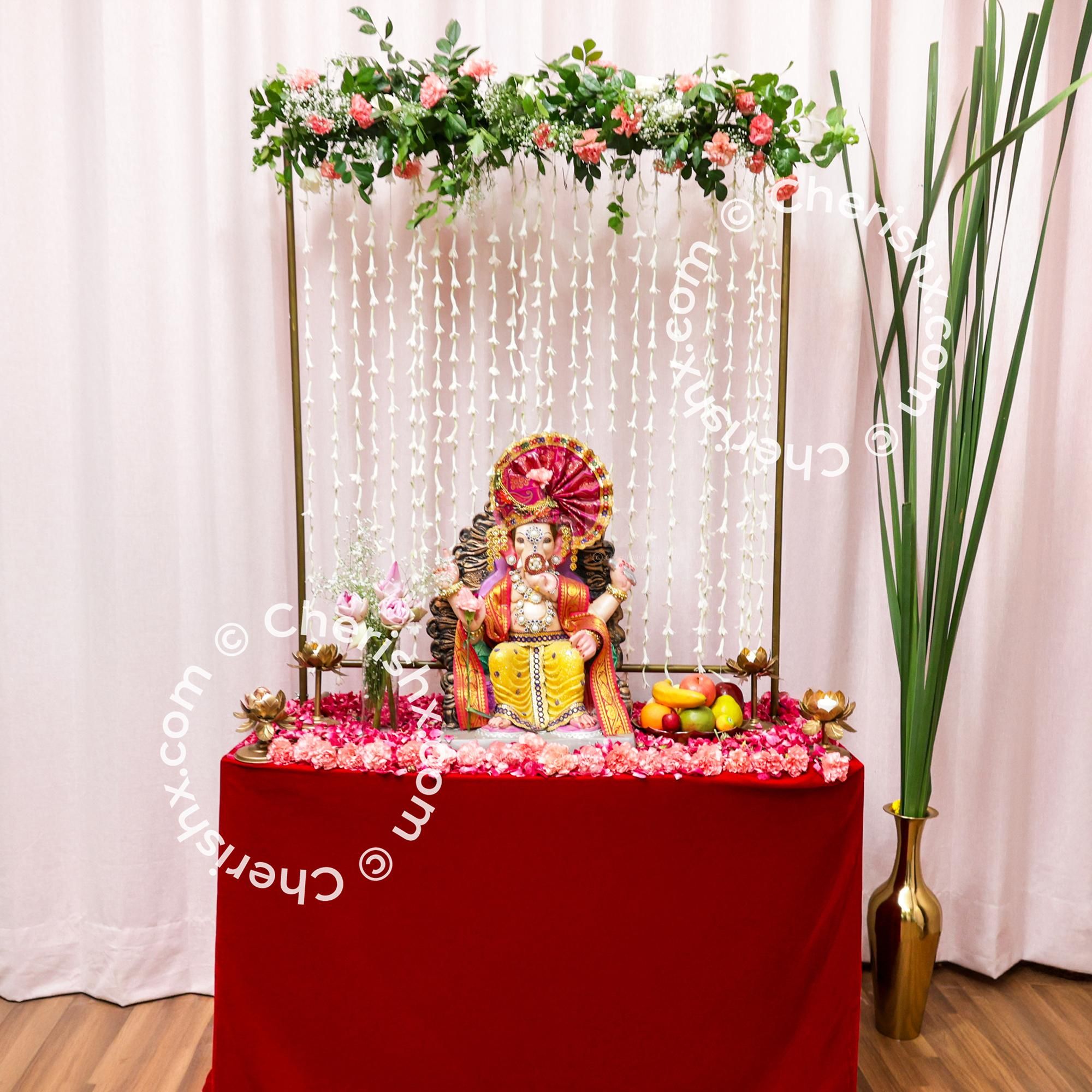 Tube rose strings make the pure and serene backdrop behind Bappa