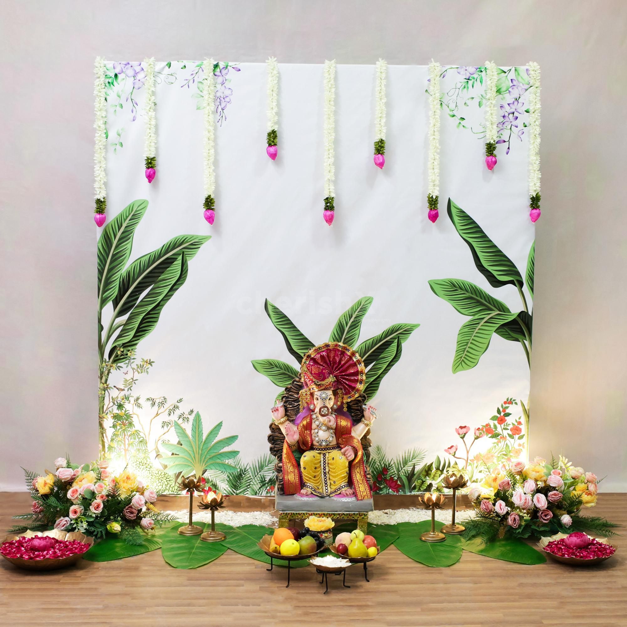 Banana leaves at the base of the puja area relate decor to the tradition