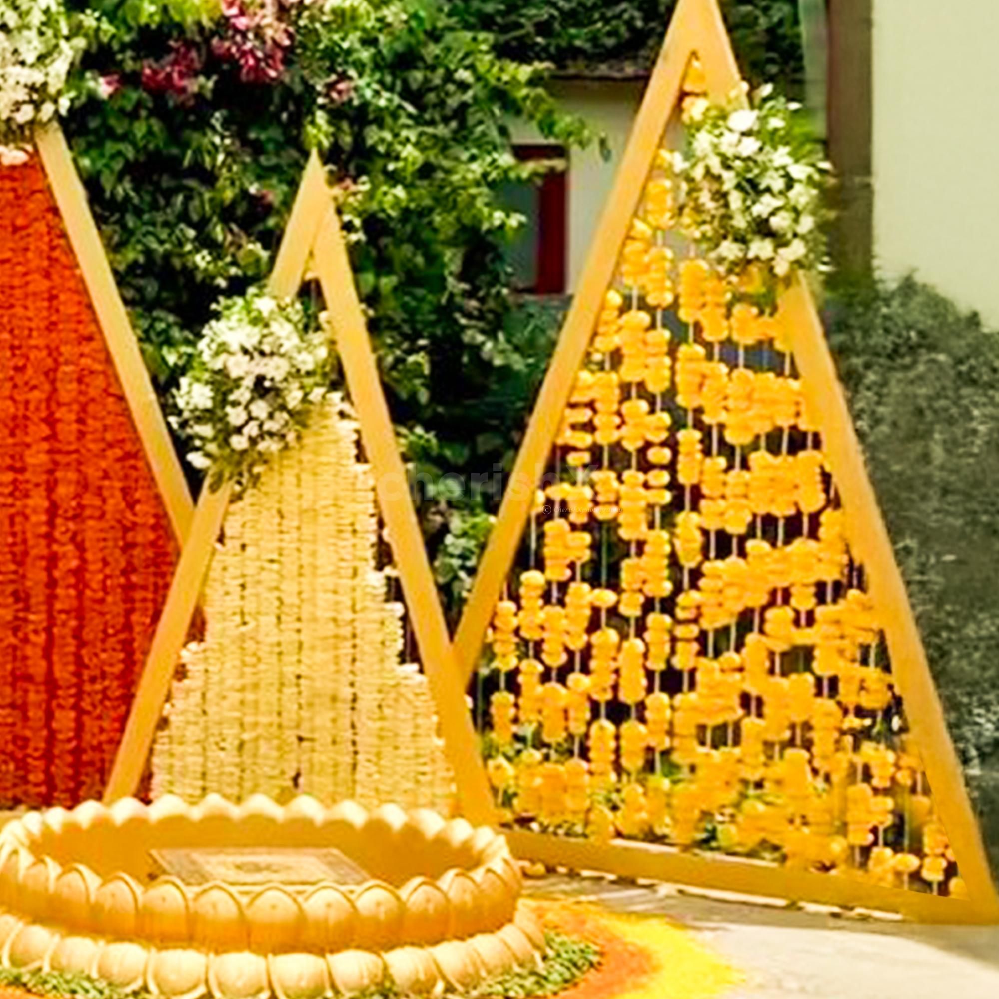 Fresh lotus flower pots bring purity and elegance to the arrangement.