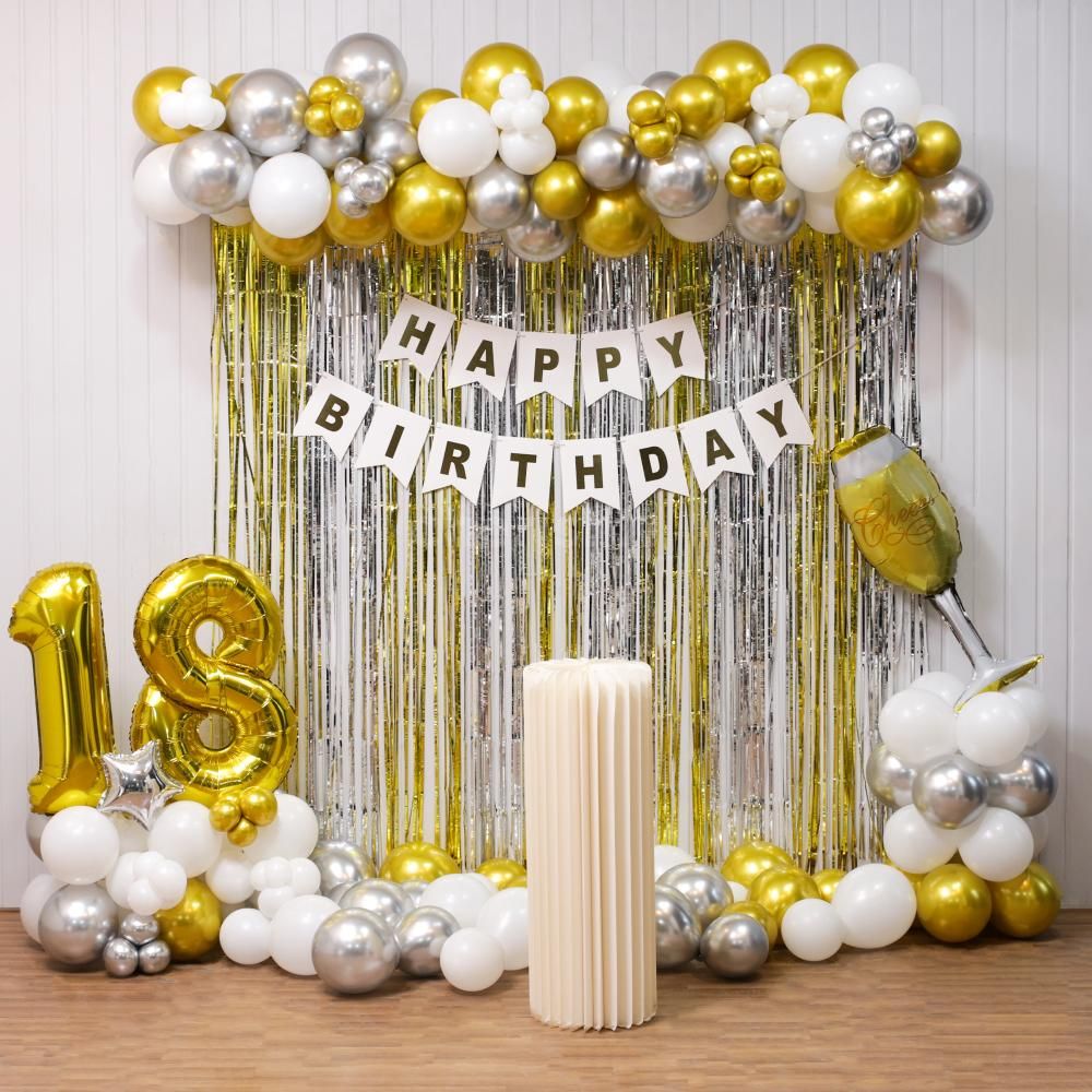 Add glamour to the birthday celebration with golden silver and white balloons