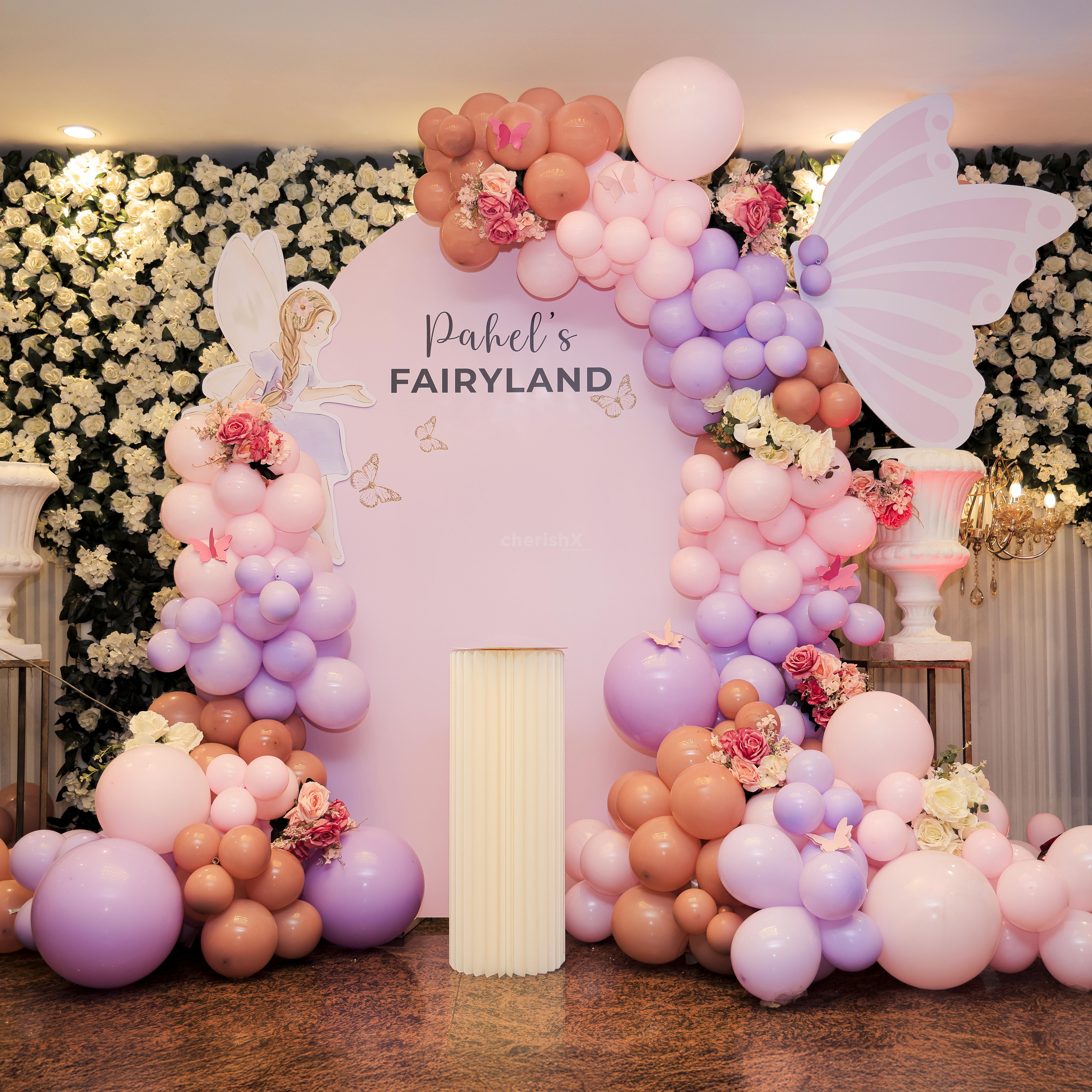 Pastel purple balloons add the colour break to the overall pink birthday decor