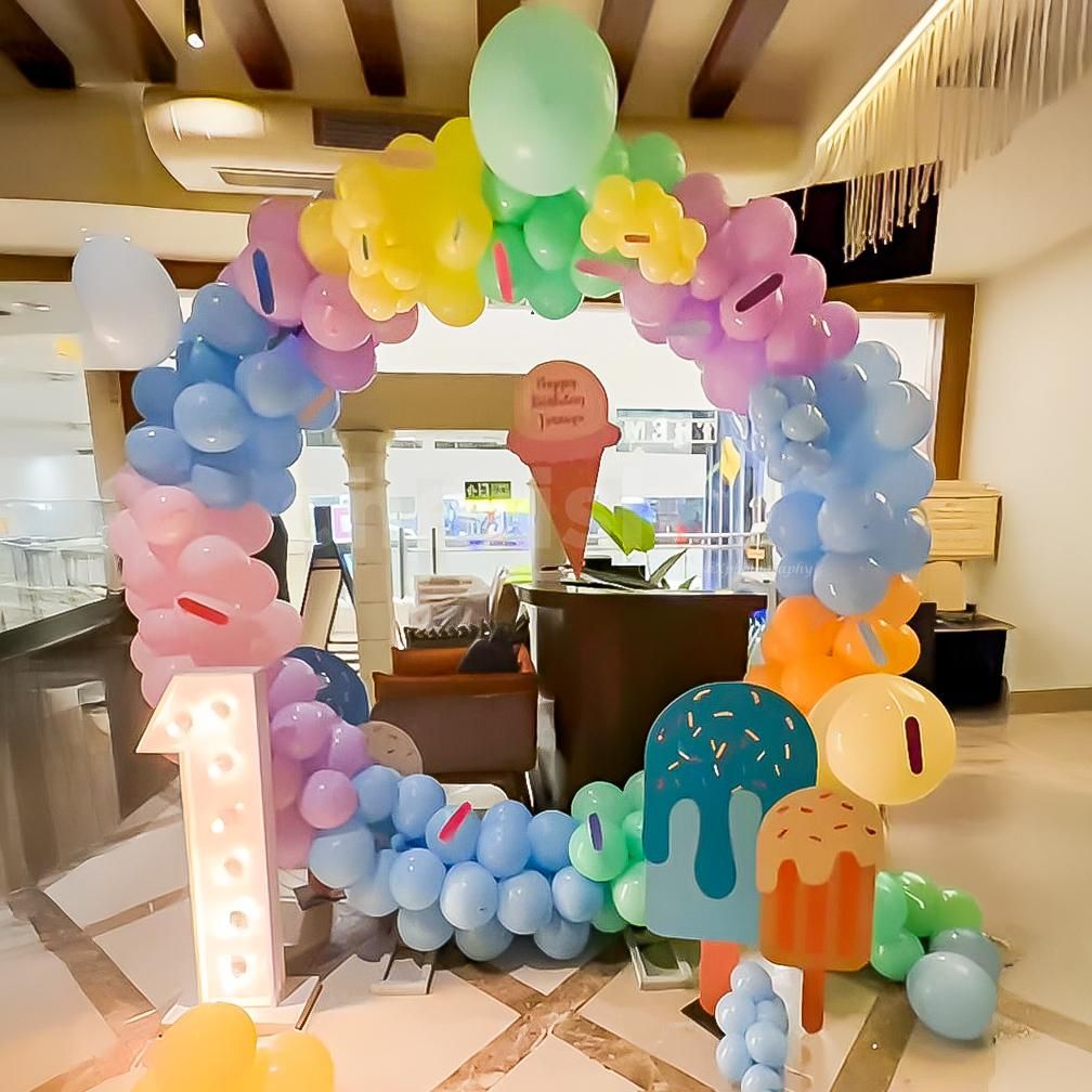 Balloons in different pastel shades and ice cream are the best decor known