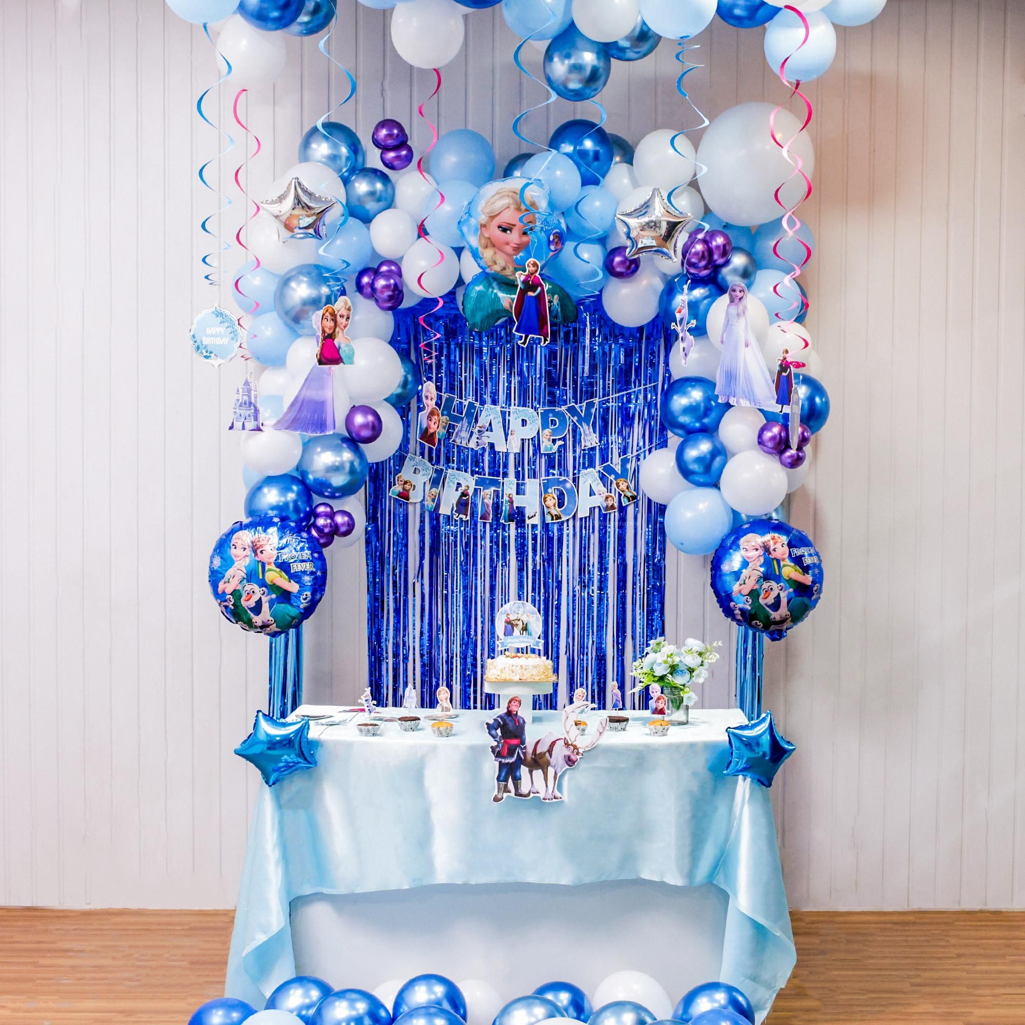 Balloons stars and dreamy swirls together create magical frozen birthday photo vibes